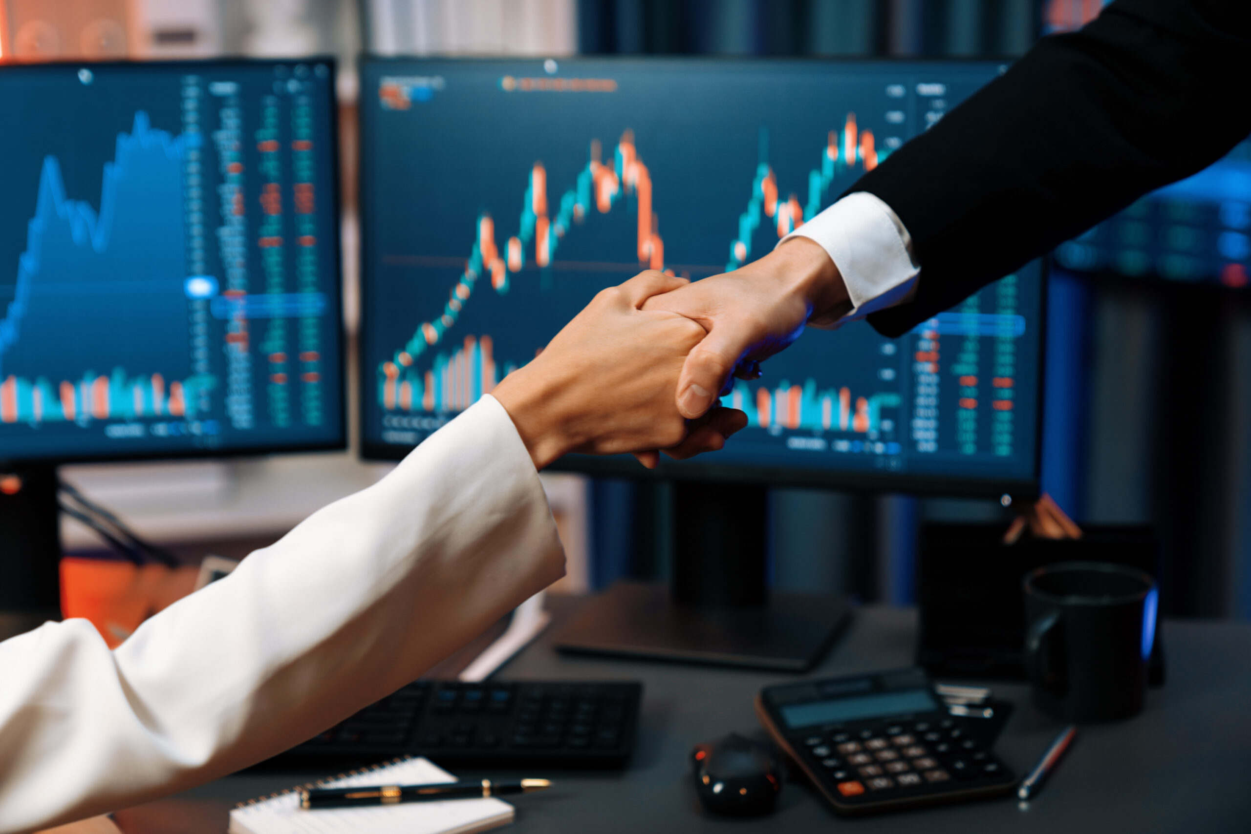 crop photo business partners checking hand with stock profit night infobahn scaled